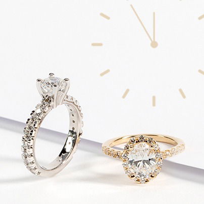 two engagement rings and a clock